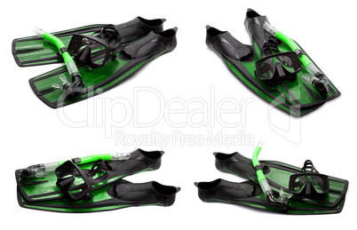 Set of green swim fins, mask and snorkel for diving on white bac