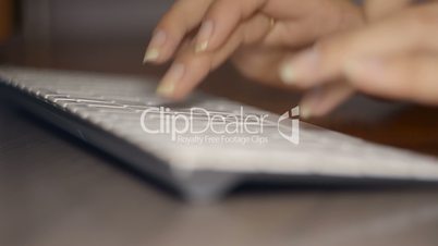 Woman`s Hands Typing On A Keyboard