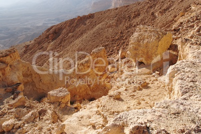 Scenic orange rocks in desert canyon (Small Crater, or Makhtesh Katan in Negev desert, Israel)