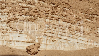 Texture of an orange weathered rock in the desert