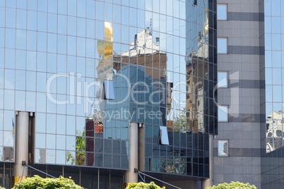 One modern building reflection in another building