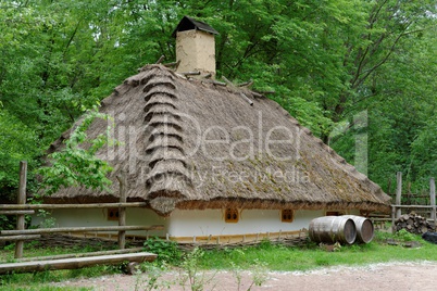 Farmer's house under the thatch roof in open air museum, Kiev, Ukraine