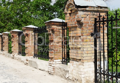 Brick and metal fence in Kiev Pechersk Lavra Monastery in Kiev, Ukraine