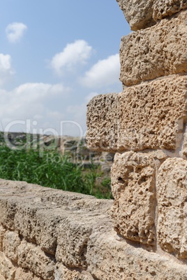 Ancient weatherd stone wall in Nahal Taninim archeological park in Israel