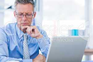 Thoughtful businessman looking away