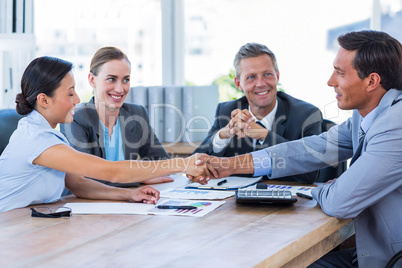 Business people shaking hands during meeting