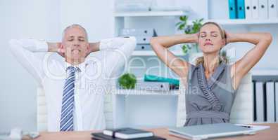 Business people relaxing in swivel chairs