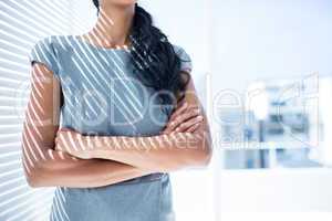 Businesswoman with arms folded in the office