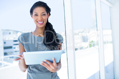 Focused businesswoman using digital tablet