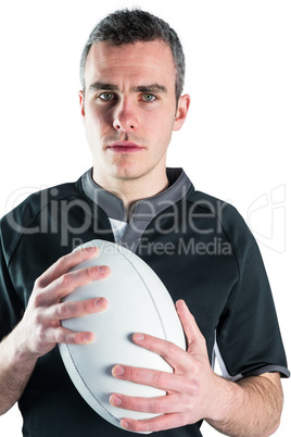 Rugby player holding a rugby ball