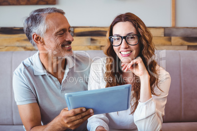 Couple using digital tablet