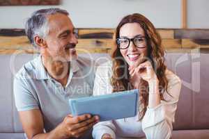 Couple using digital tablet