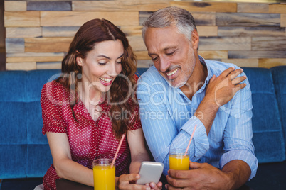 Cute couple sitting in cafe