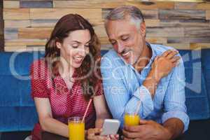 Cute couple sitting in cafe