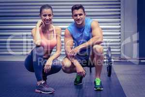 Muscular couple looking at the camera