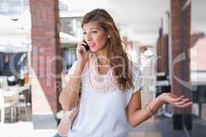 Woman arguing with someone on the telephone