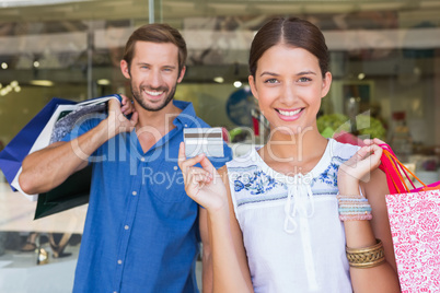 Young happy couple looking at camera