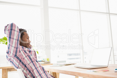 Young businessman relaxing at his desk