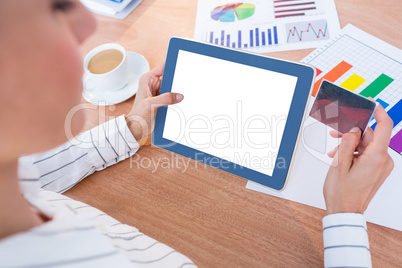 Businesswoman using her digital tablet