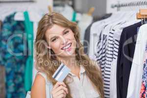 A pretty blonde woman showing her credit cards