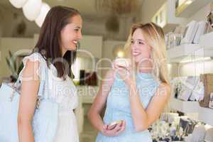 Happy women trying cosmetic products