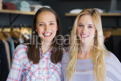Two pretty women smiling at camera