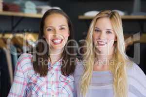 Two pretty women smiling at camera