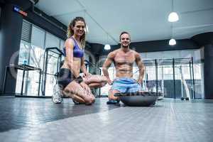 Muscular couple looking at the camera