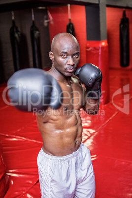 Young bodybuilder looking serious in the camera