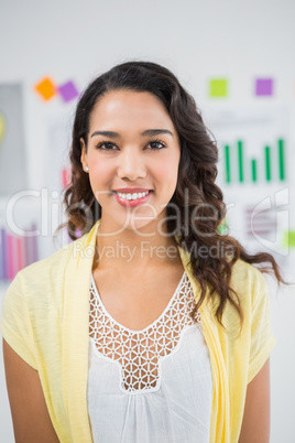 Young smiling businesswoman facing the camera