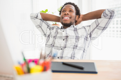 Young businessman sitting at his desk