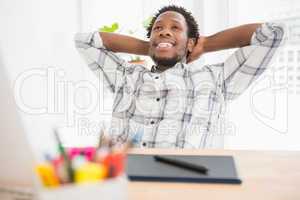 Young businessman sitting at his desk