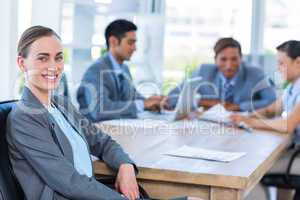 Business people speaking together during meeting