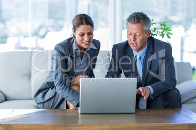 Business people using laptop computer