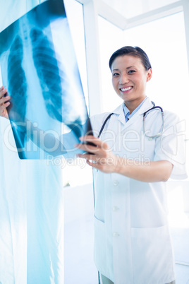 Female doctor examining x-ray