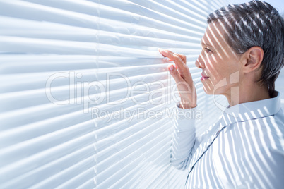 Businesswoman looking through stores in the office