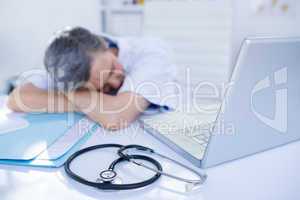 Female doctor sleeping on desk