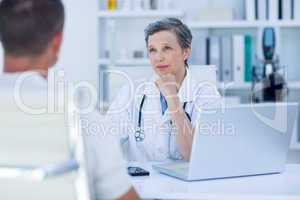 Female doctor speaking with her patient