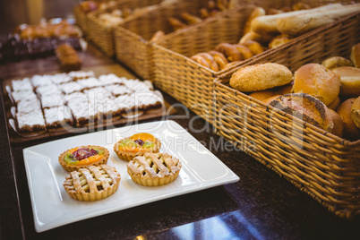 Close up of basket with fresh bread and pastry