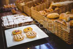 Close up of basket with fresh bread and pastry