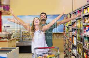 Happy bright couple buying food products