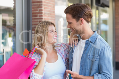 A happy couple with shopping bags