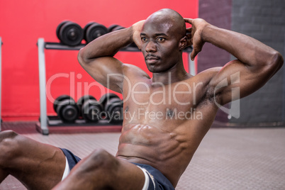 Young bodybuilder doing excercises