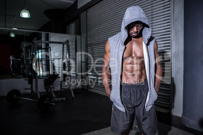 Young Bodybuilder in a hoodie looking at the ground