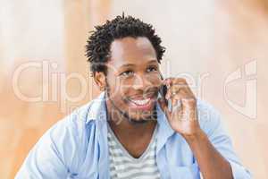 Young creative businessman on the phone