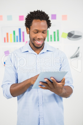 Young creative business man with tablet