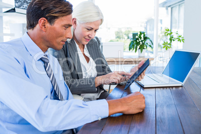 Business people working on tablet computer