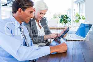 Business people working on tablet computer