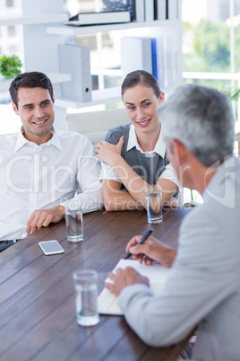 Casual business people speaking together