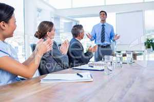 Business people applauding during a meeting